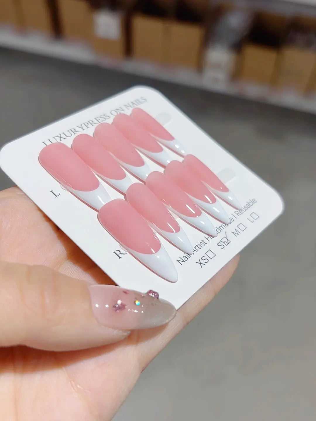 handmade press on nails long almond pink french tips, angled perspective
