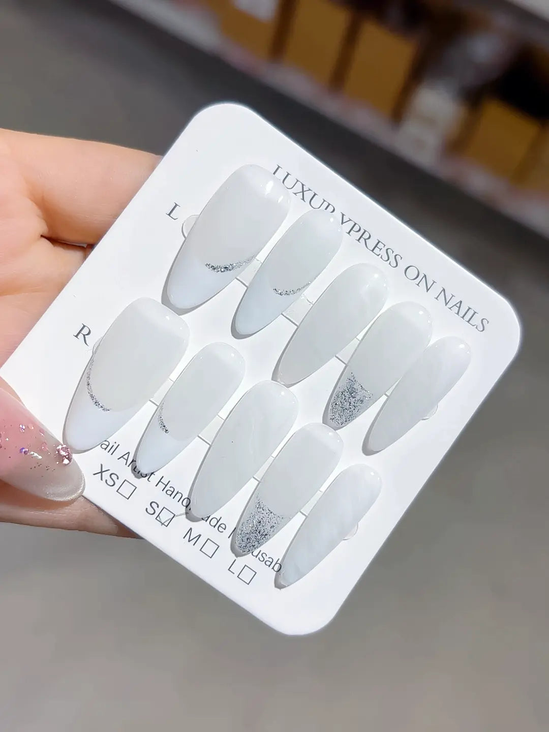 long almond white french handmade press on nails with silver glitter lines, close-up top row