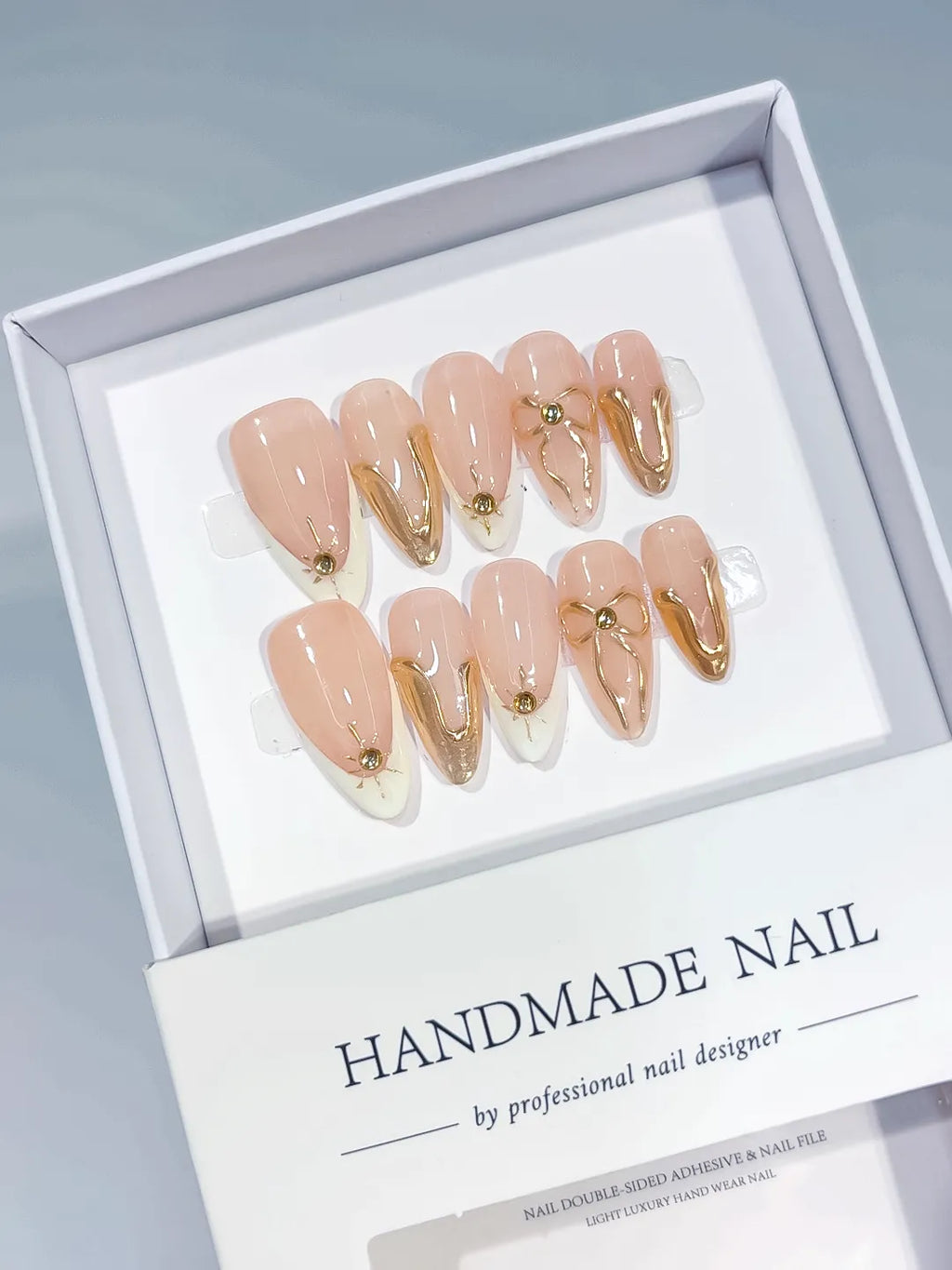 Nude White Gold Metallic Star Gold Swirl press on nails angled view
