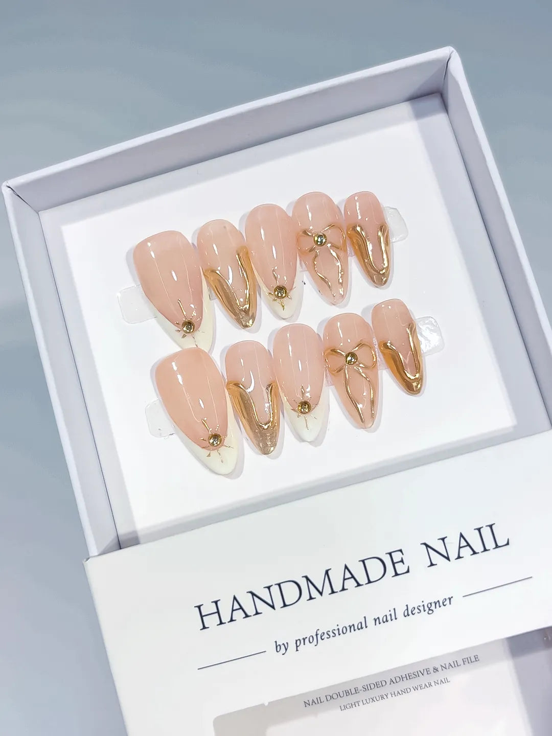 Nude White Gold Metallic Star Gold Swirl press on nails angled view