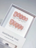 Close-up of aurora chrome finish on medium almond handmade press on nails featuring luxury French design.
