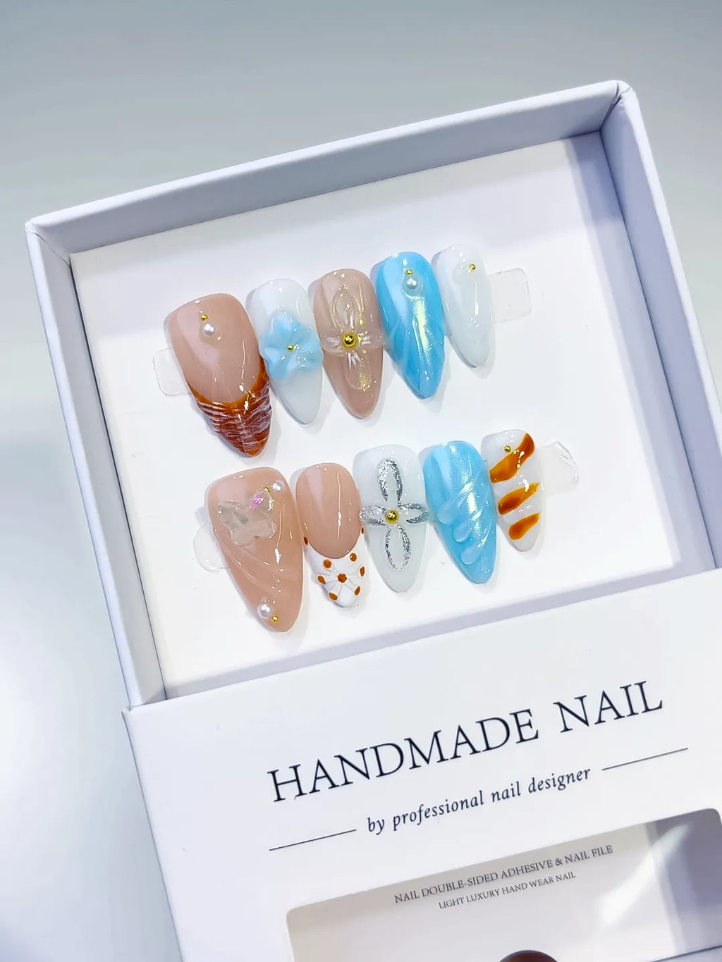Nude Blue White Orange Abstract Bow Dot Pattern Flower press on nails angled view