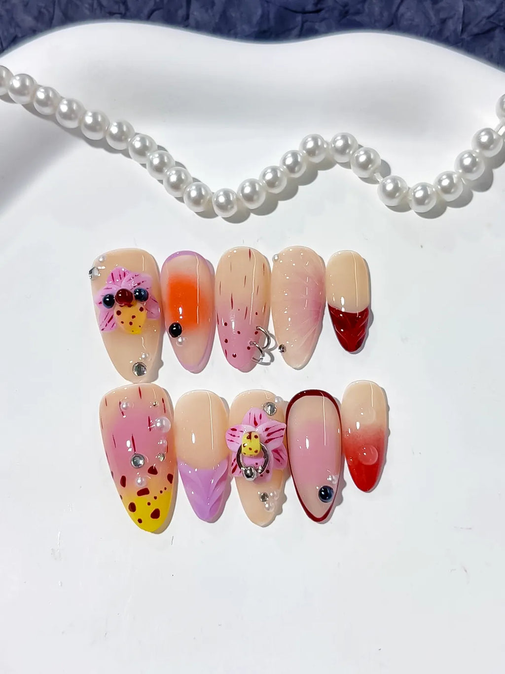 Nude Pink Yellow Red Abstract Bow Ladybug Rhinestone press on nails detail view