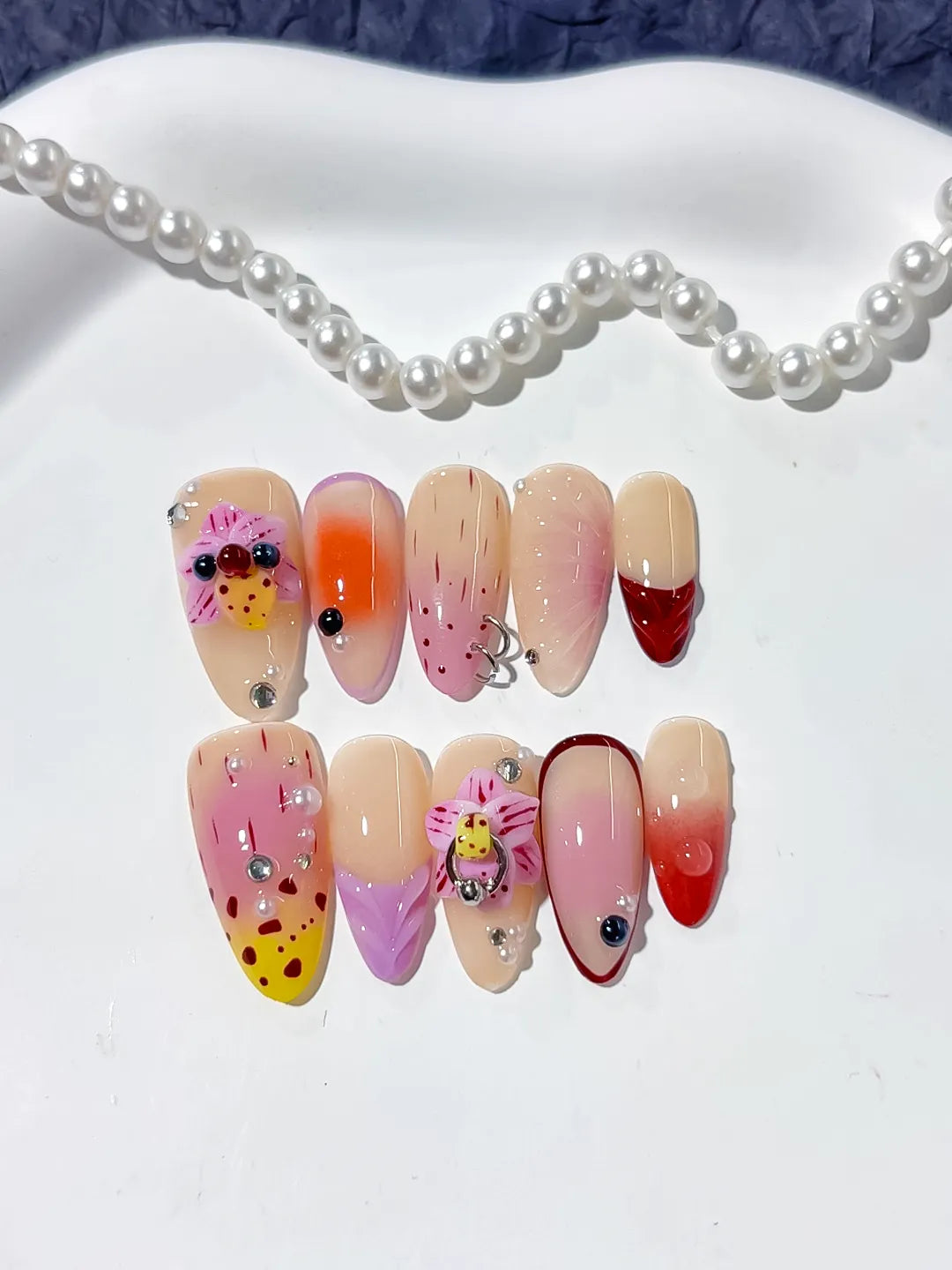 Nude Pink Yellow Red Abstract Bow Ladybug Rhinestone press on nails detail view