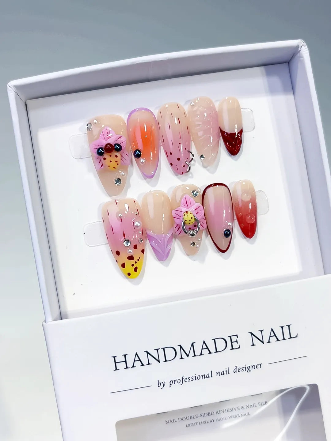 Nude Pink Yellow Red Abstract Bow Ladybug Rhinestone press on nails angled view