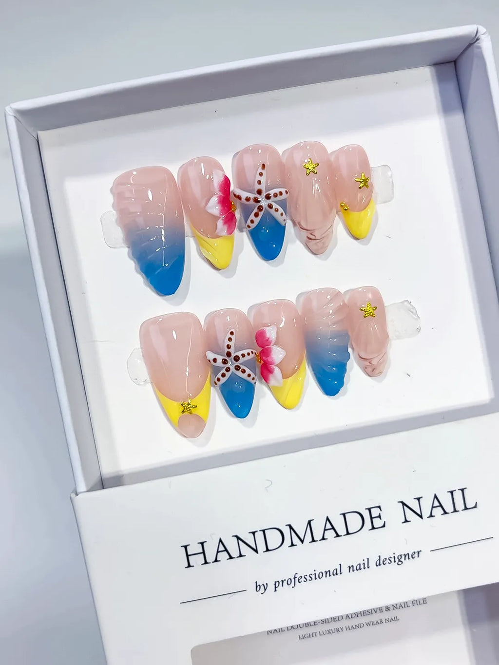 Nude Blue Yellow Pink Abstract Flower Starfish Shell press on nails angled view