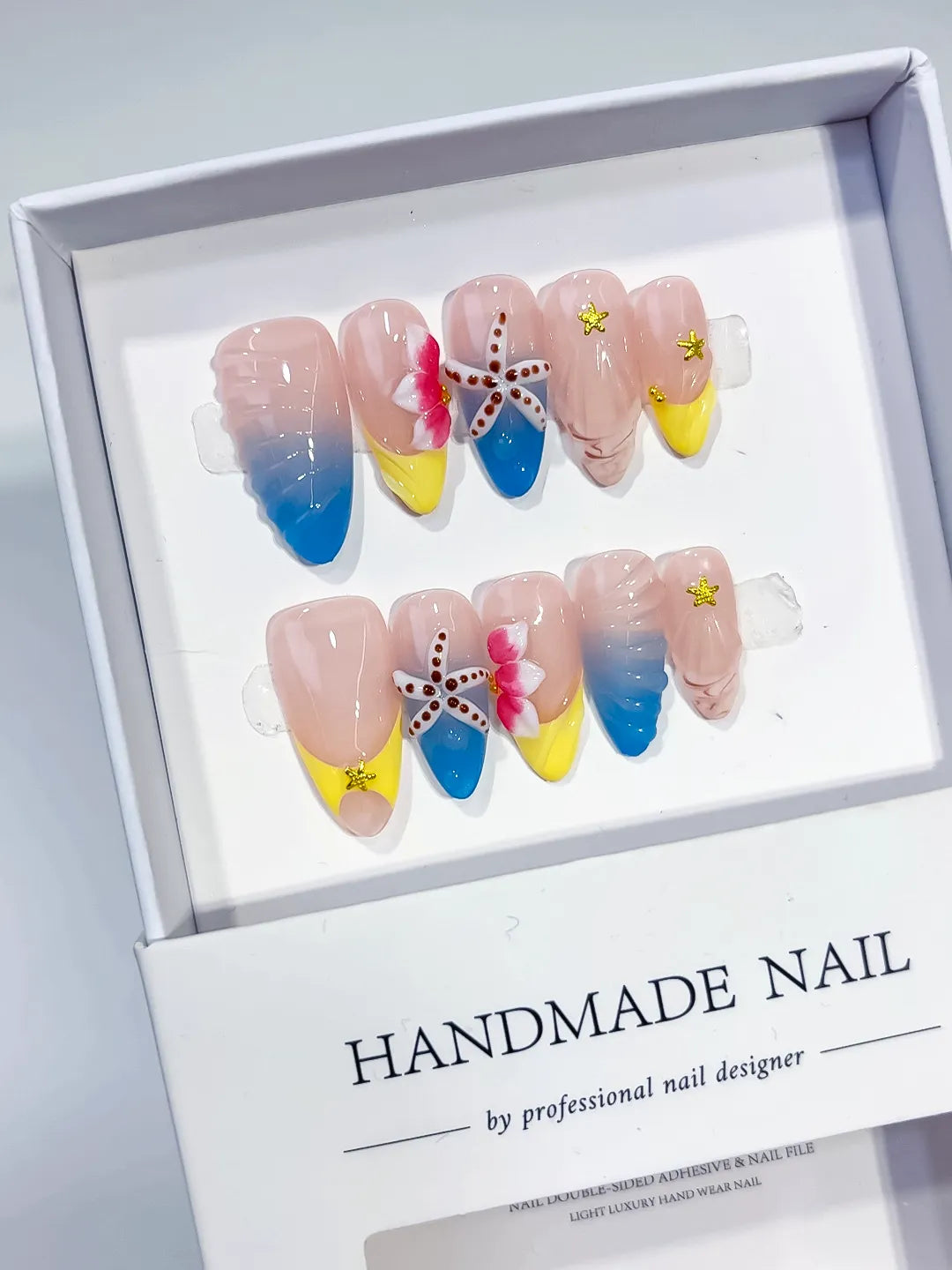 Nude Blue Yellow Pink Abstract Flower Starfish Shell press on nails angled view
