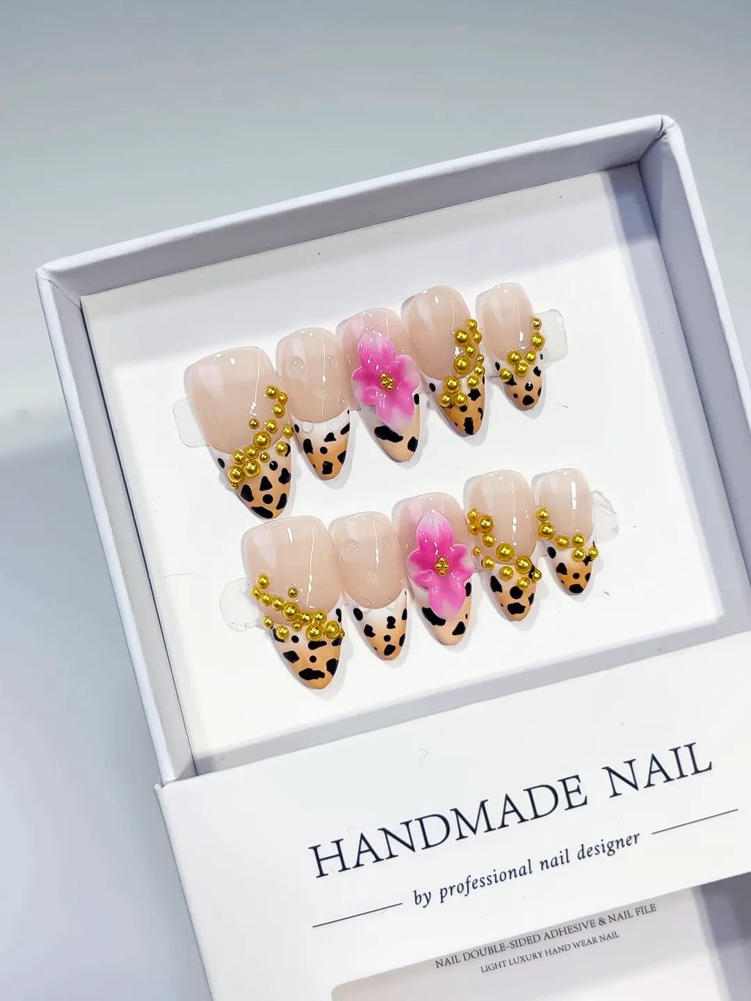 Nude Black Gold Pink French tip Flower Animal Print Stud press on nails angled view