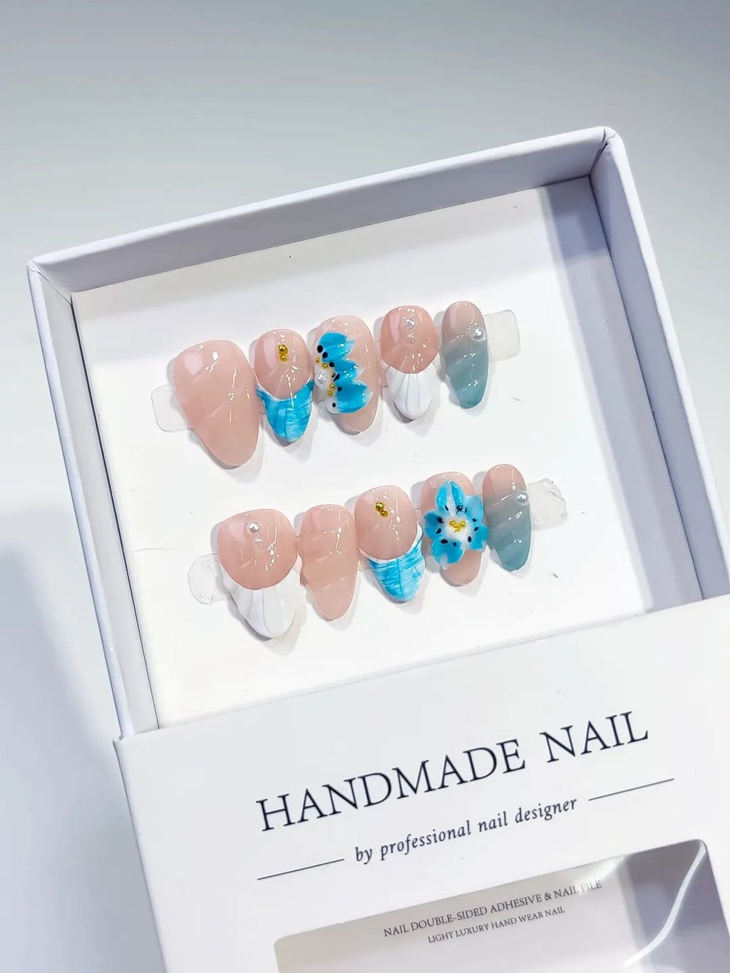 Nude White Blue French tip Flower Shell press on nails angled view