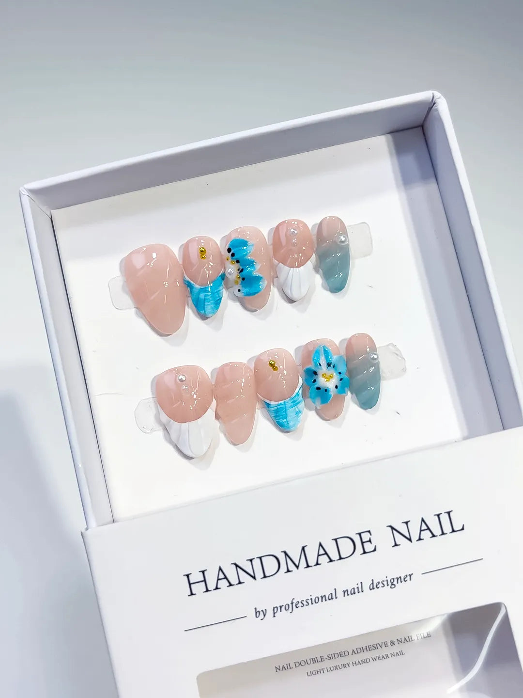 Nude White Blue French tip Flower Shell press on nails angled view
