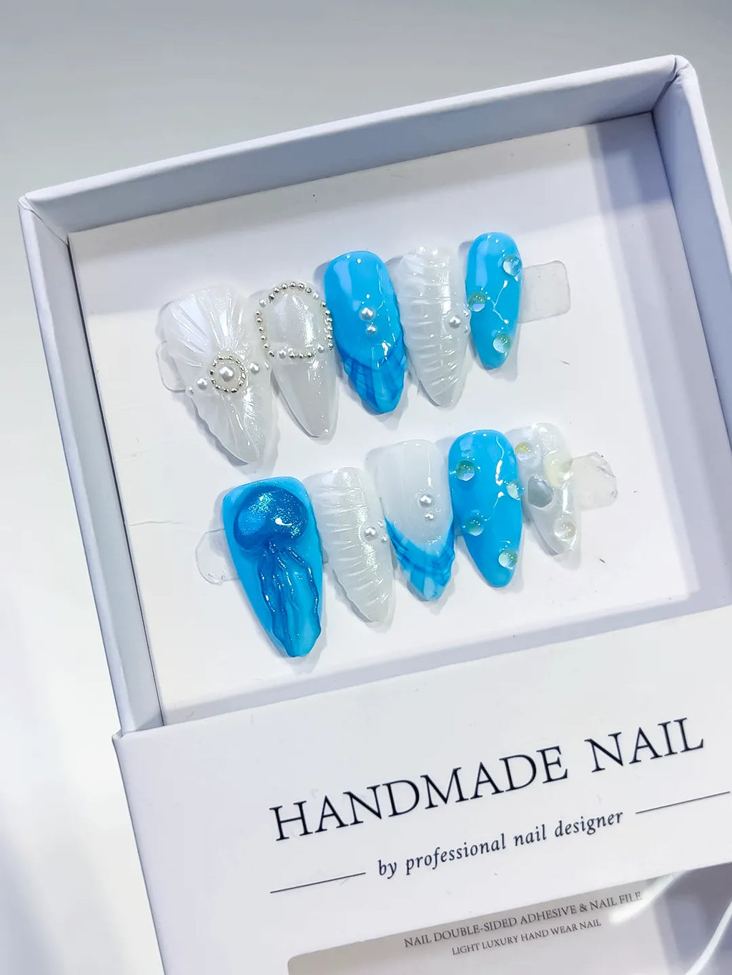 Blue White Abstract Bow Pearl Shell press on nails angled view