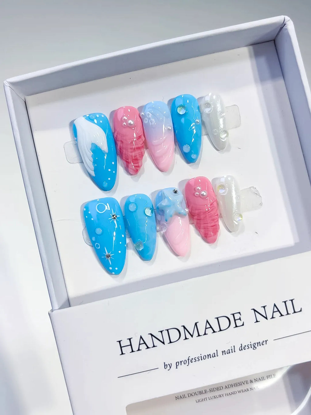 Blue Pink White Abstract Shell Star press on nails angled view