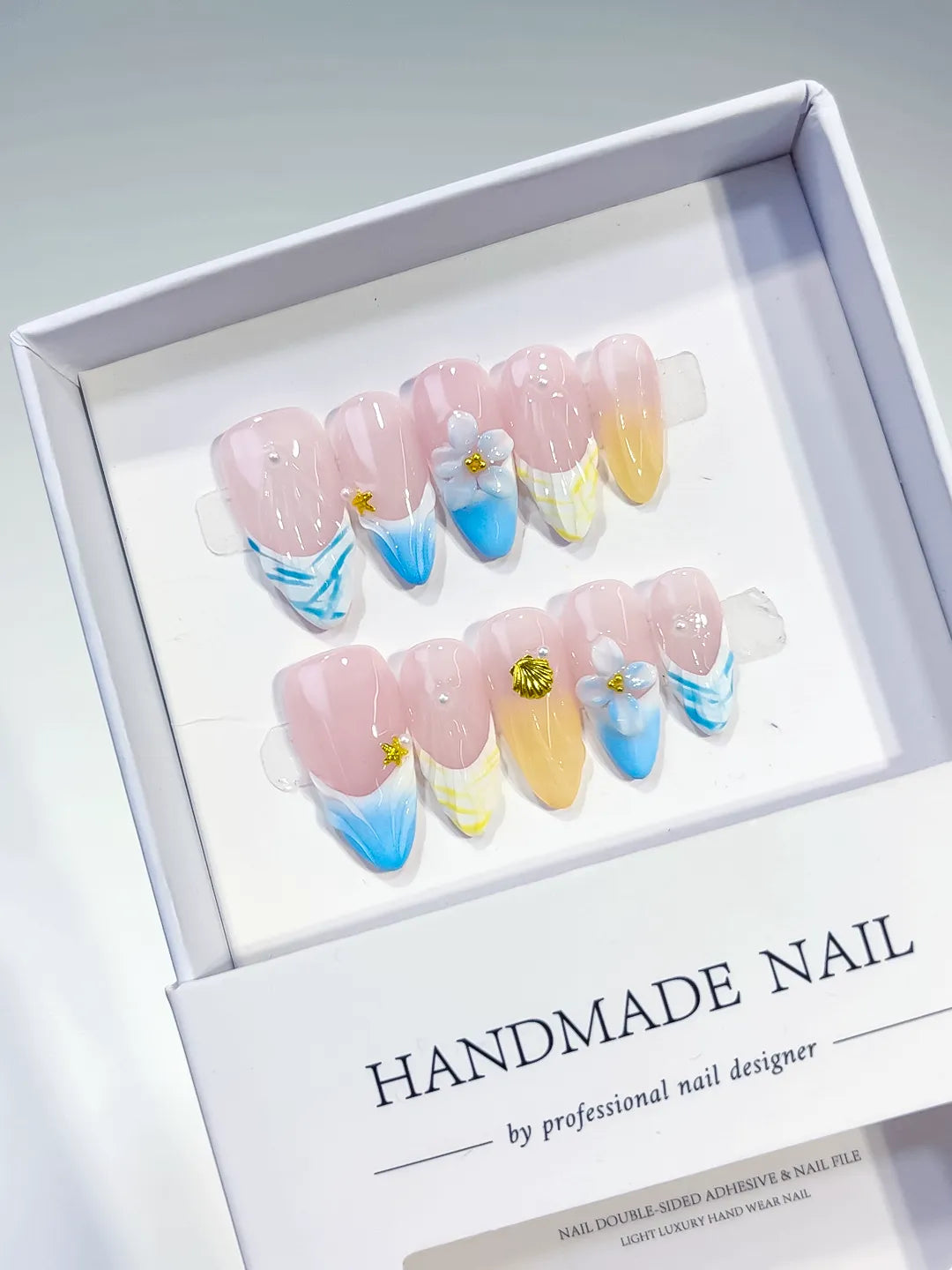Nude Blue Yellow White French tip Flower Shell Star press on nails angled view