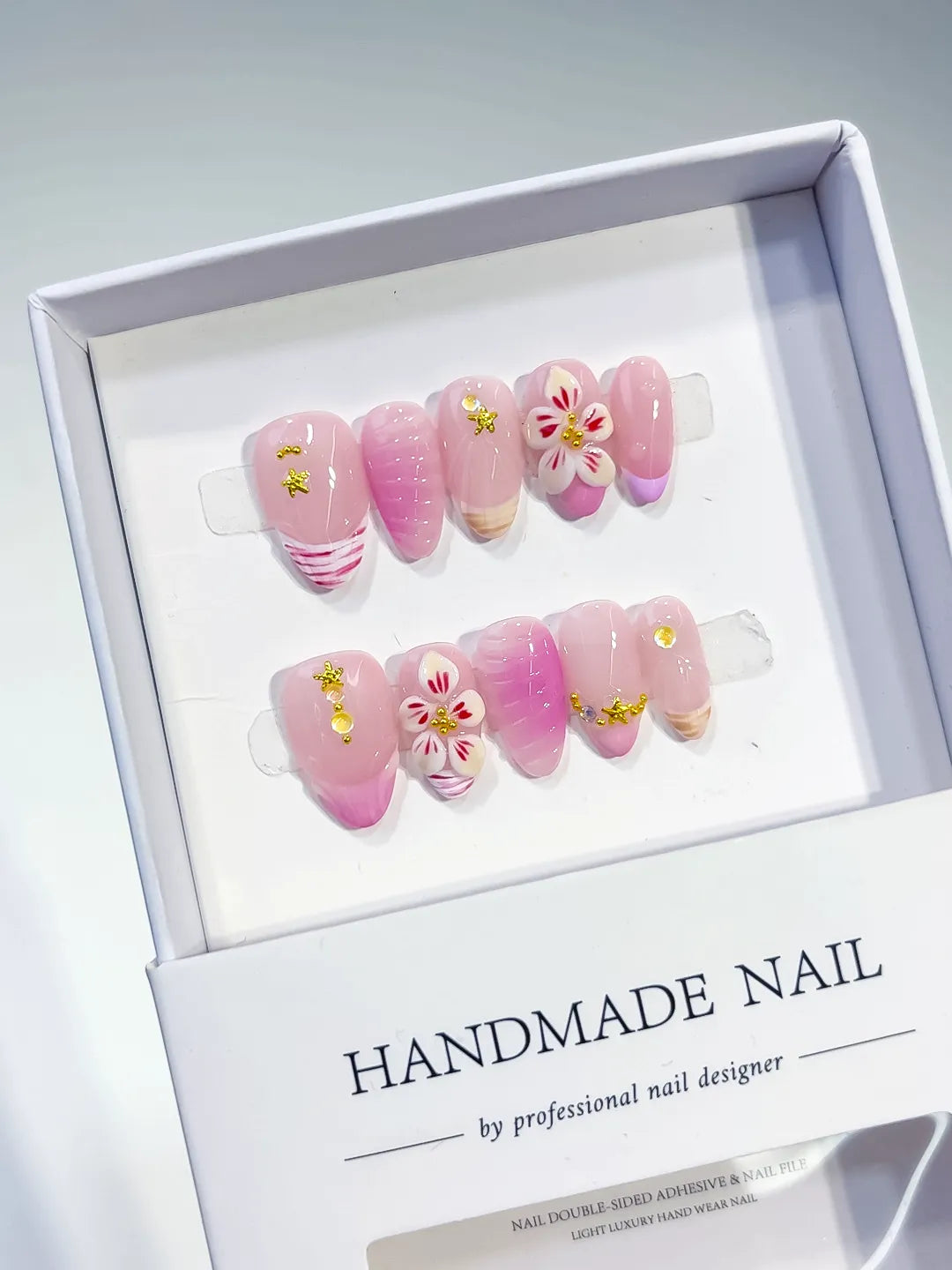 Pink White Gold Ombre Flower Star press on nails angled view