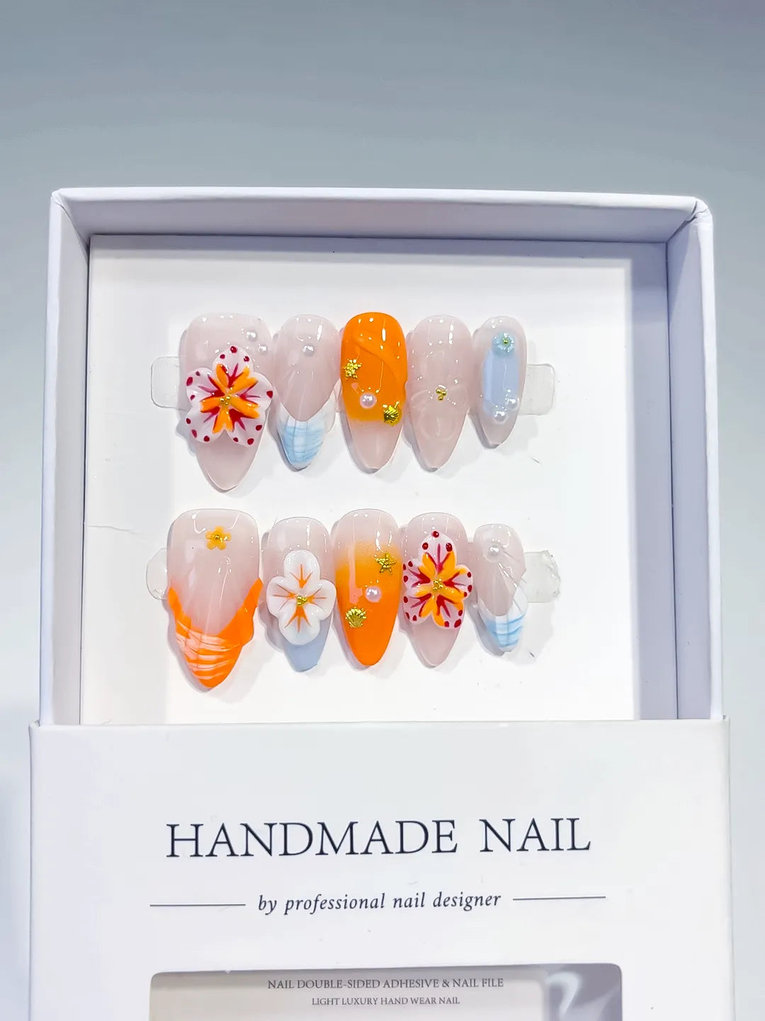 Nude Orange White Blue Abstract Flower Shell Rhinestone press on nails full set view