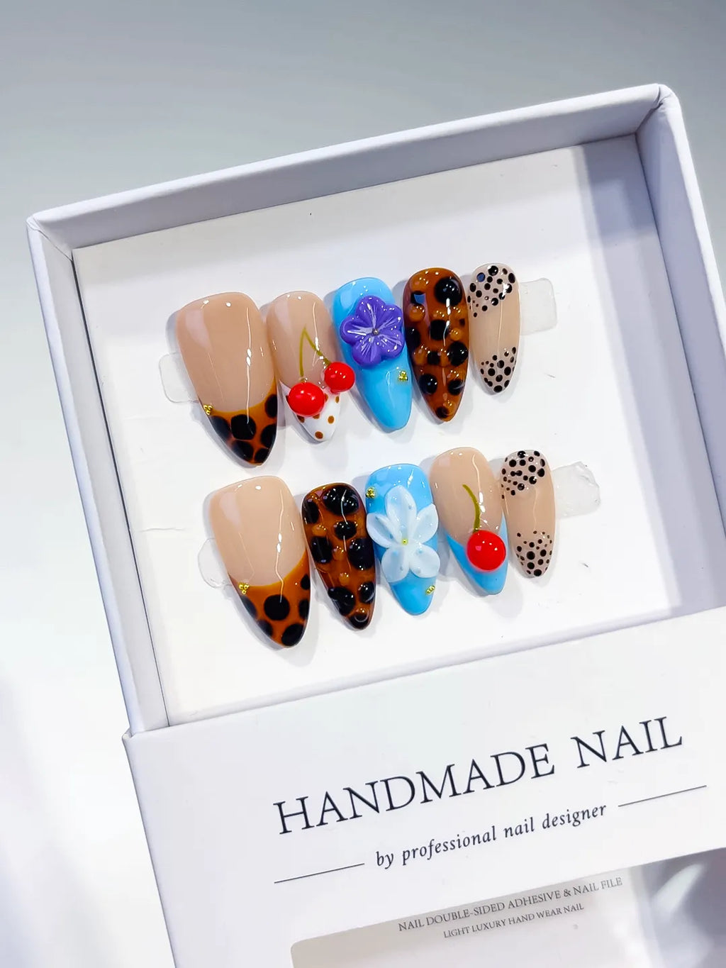 Nude Brown Black Blue Red Abstract Cherry Flower Animal Print press on nails angled view