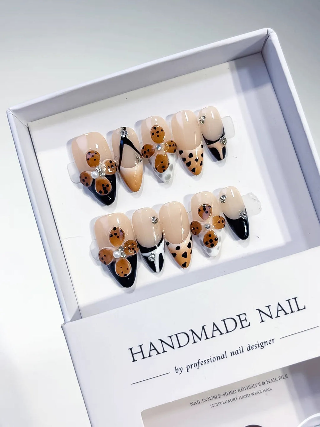 Nude Black Brown White French tip Cookie Animal Print Rhinestone press on nails angled view