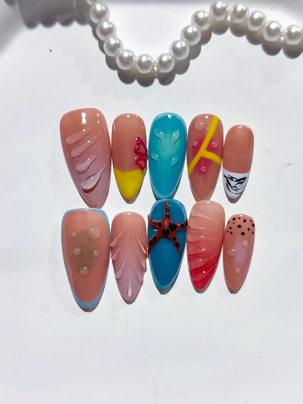 Pink Blue Yellow Red Black Abstract Starfish Leaf Dot Pattern press on nails detail view
