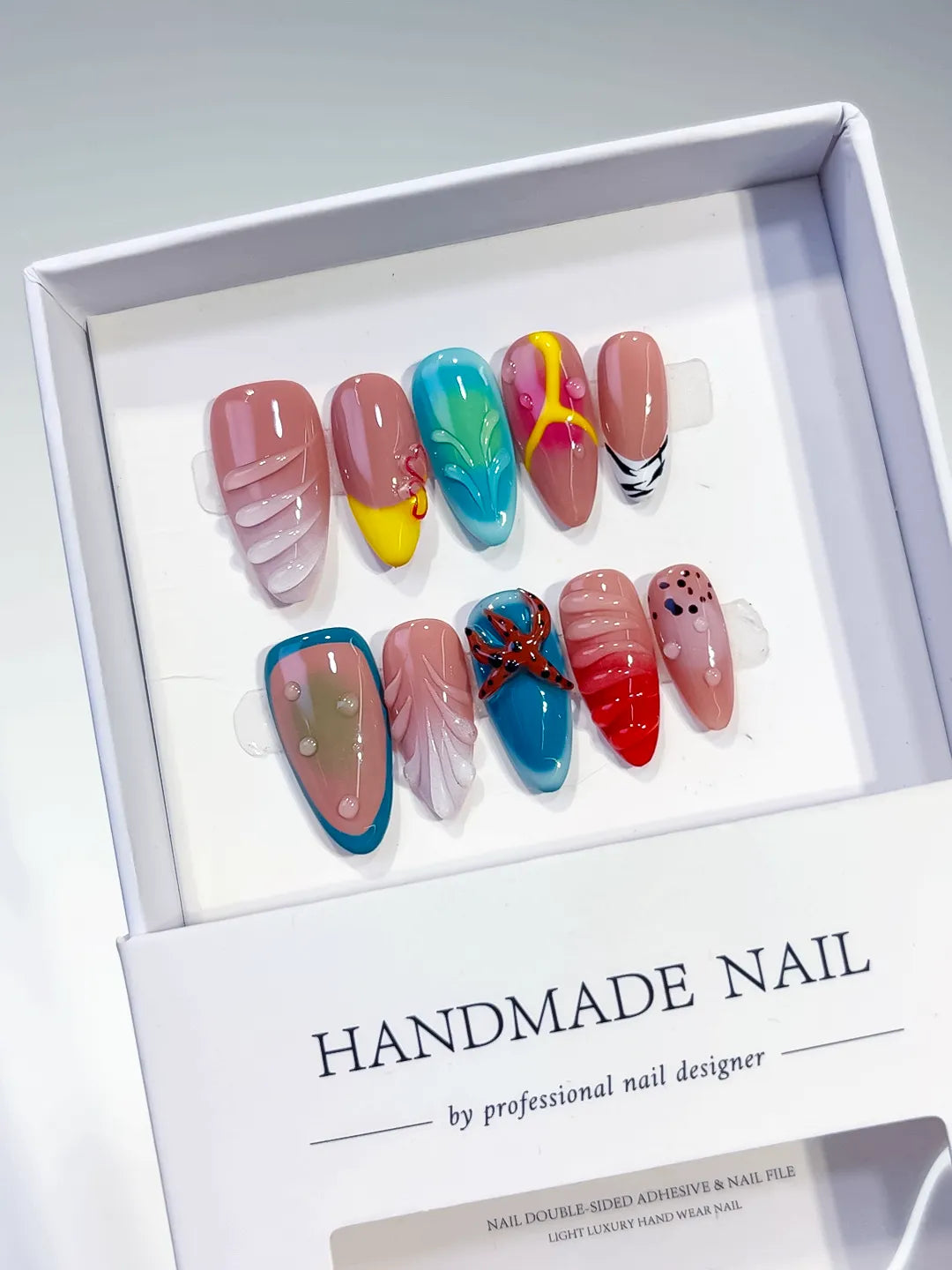 Pink Blue Yellow Red Black Abstract Starfish Leaf Dot Pattern press on nails angled view