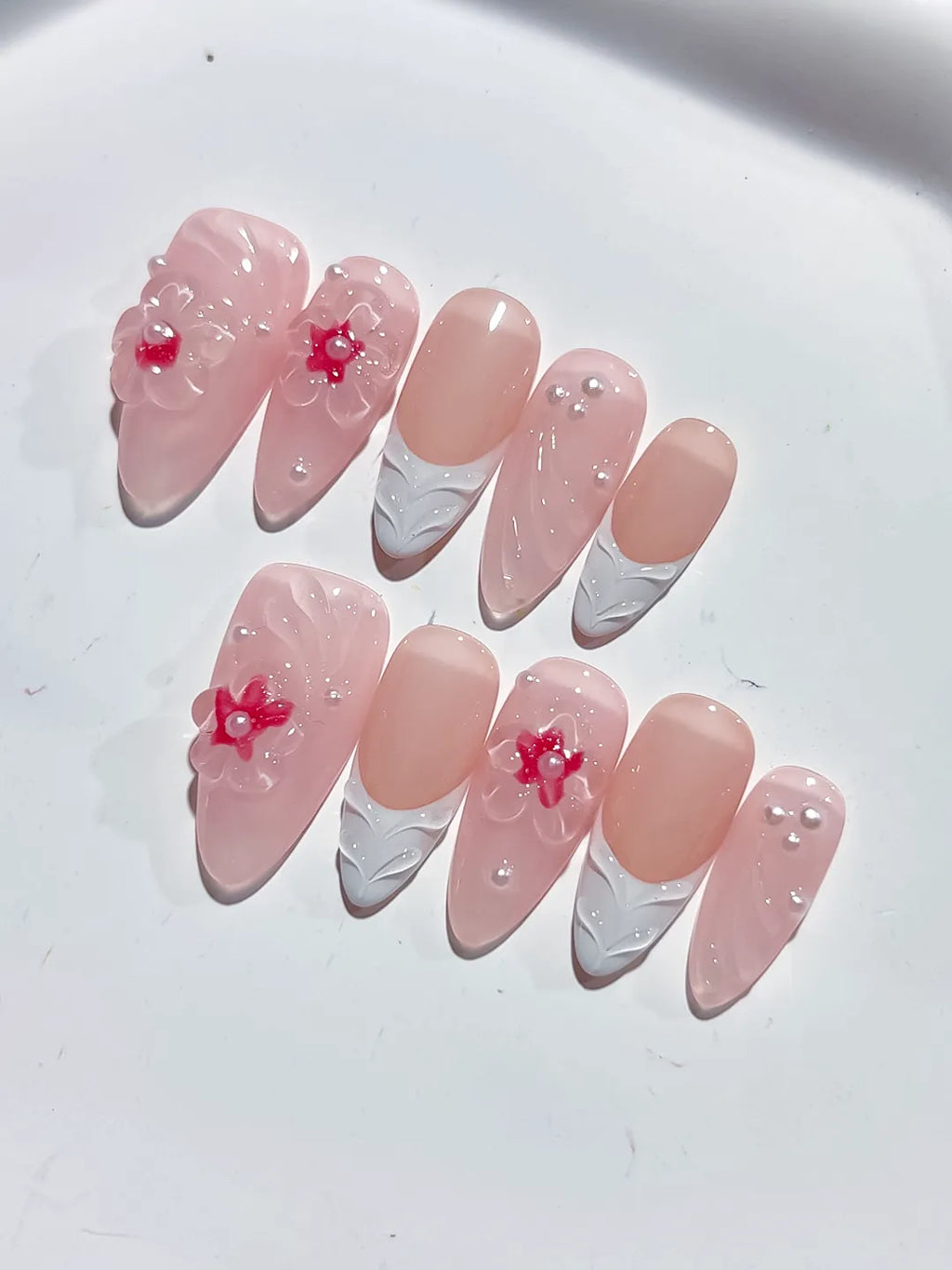 Pink White Solid color Flower Pearl Bow press on nails close up
