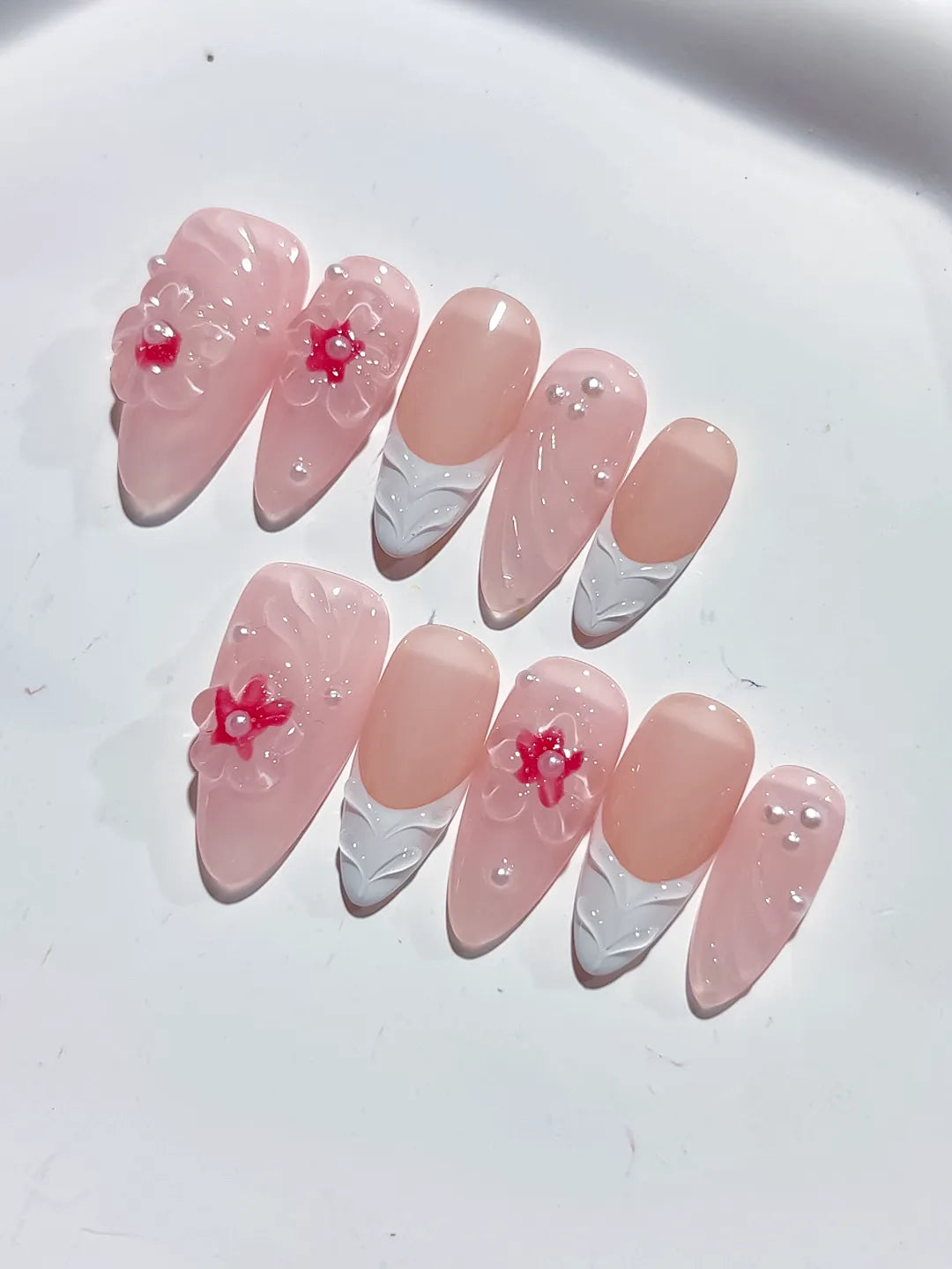 Pink White Solid color Flower Pearl Bow press on nails close up