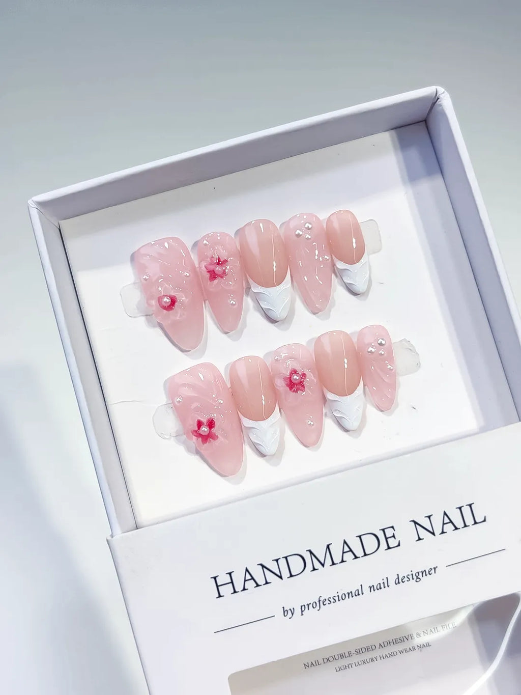 Pink White Solid color Flower Pearl Bow press on nails angled view
