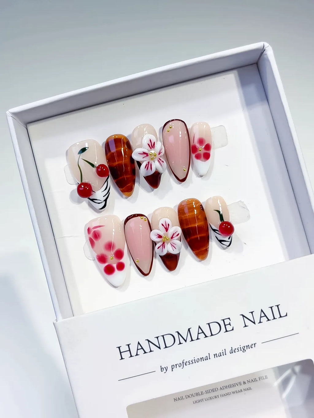 Nude Brown White Pink Red Abstract Cherry Flower Plaid press on nails angled view
