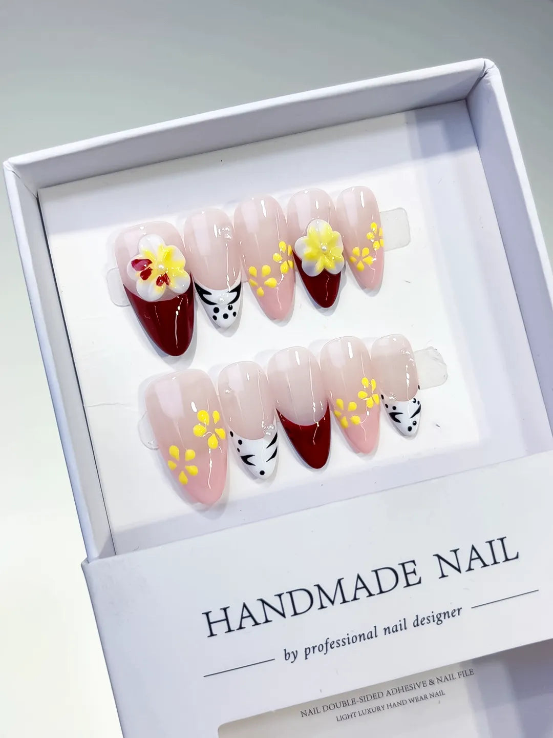 Nude Red White Yellow French tip Flower Animal Print press on nails angled view
