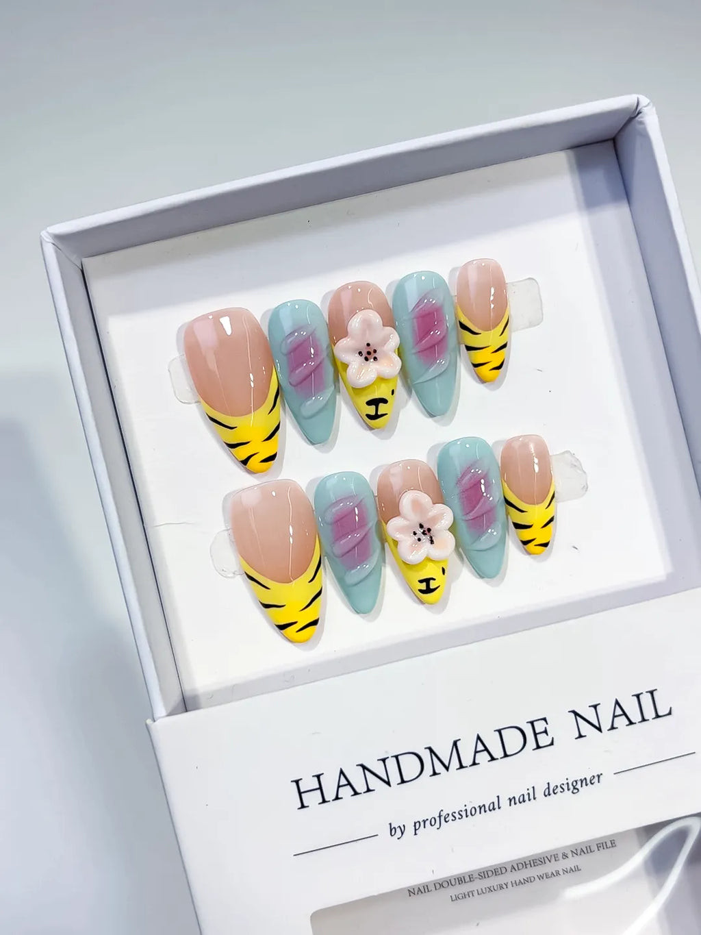 Nude Yellow Green Black Abstract Flower Animal Print press on nails angled view