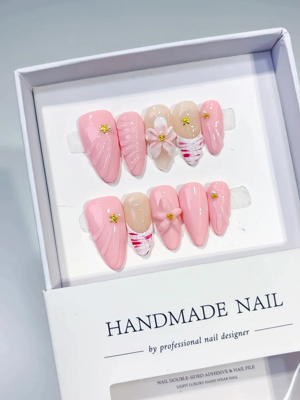Pink Nude White Solid color Flower Star Shell press on nails angled view