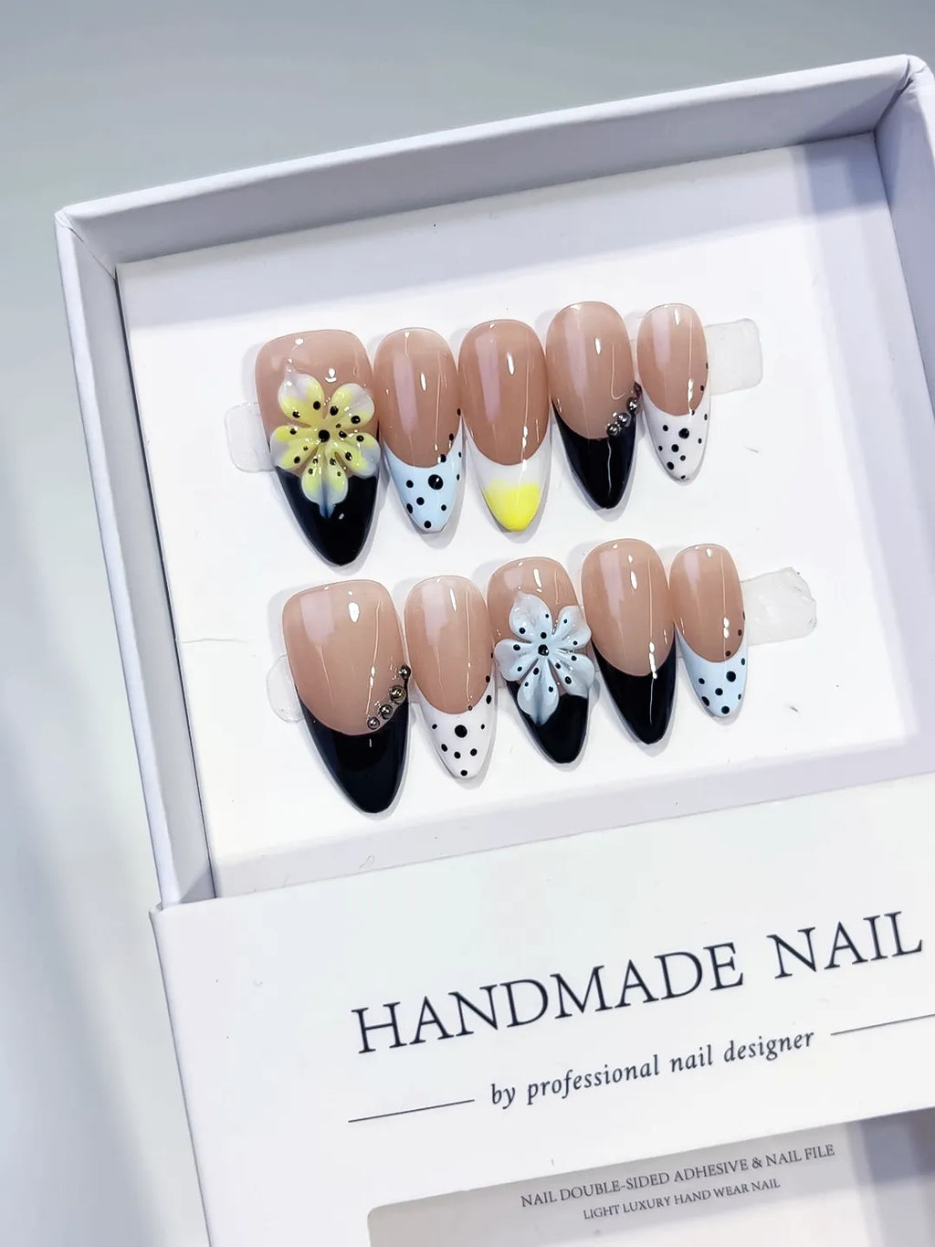 Nude Black White Yellow French tip Flower Bow Dot Pattern press on nails angled view