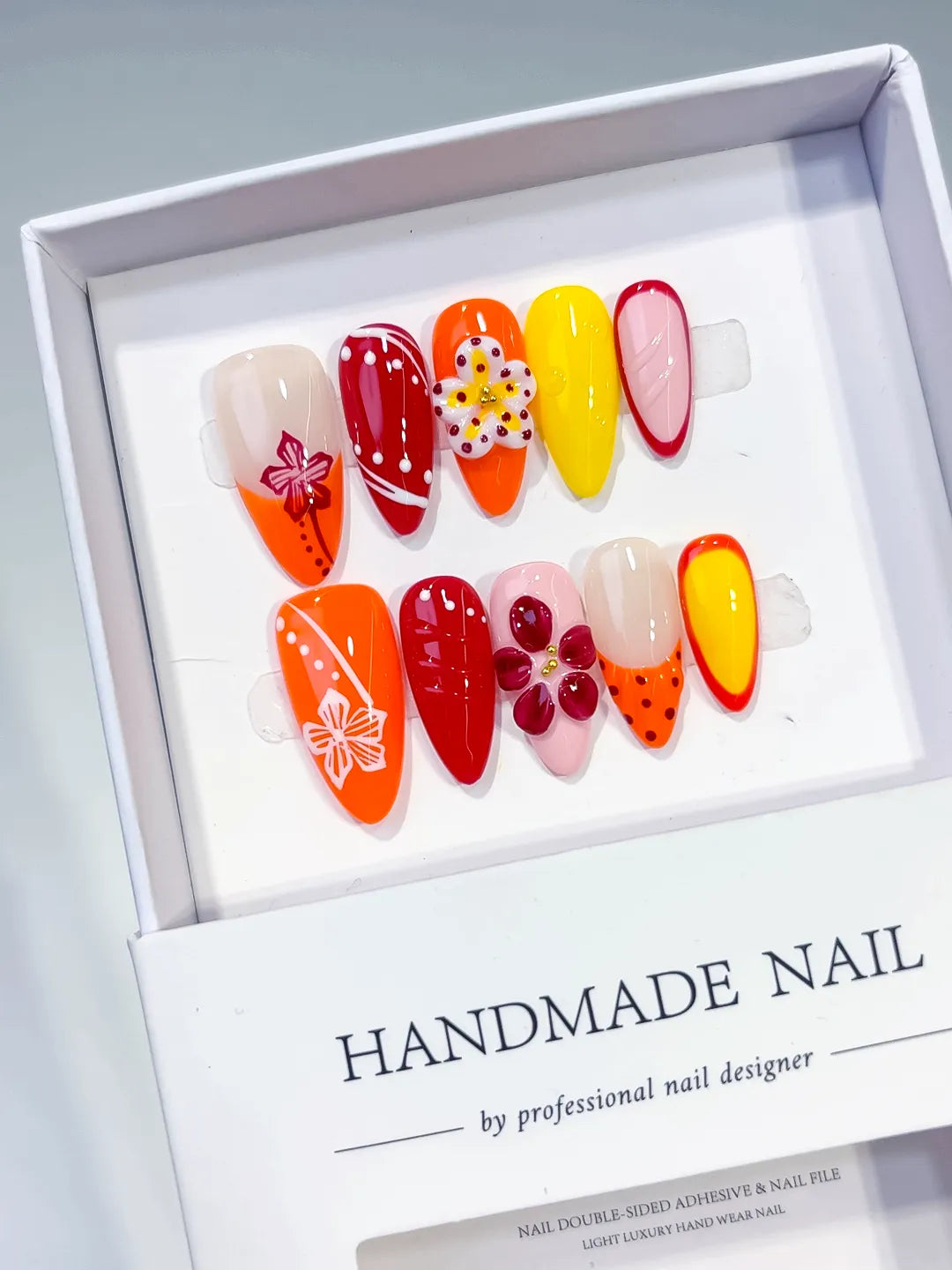 Orange Red Yellow Pink Abstract Flower Heart Dot Pattern press on nails angled view