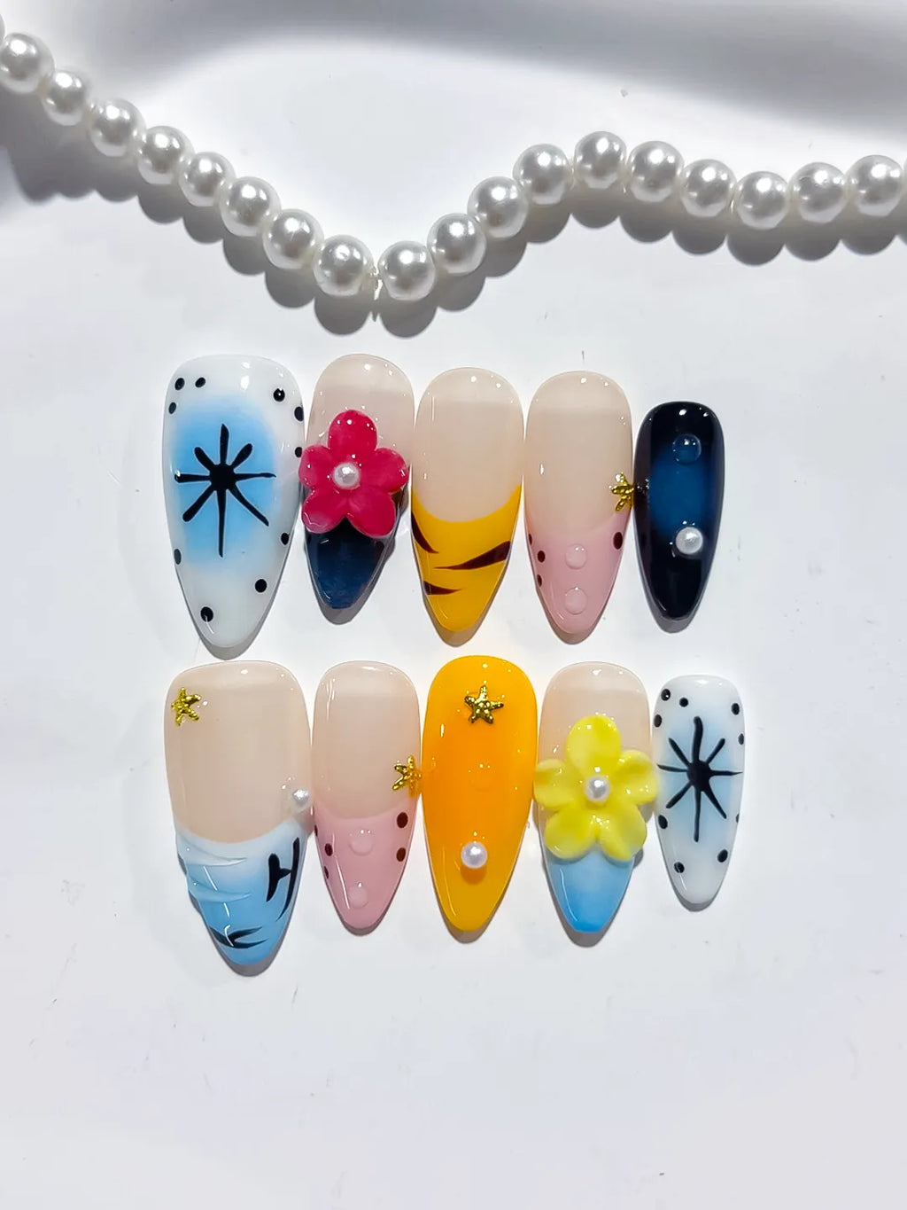 Blue Yellow Pink White Black Abstract Flower Star Dot Pattern press on nails detail view