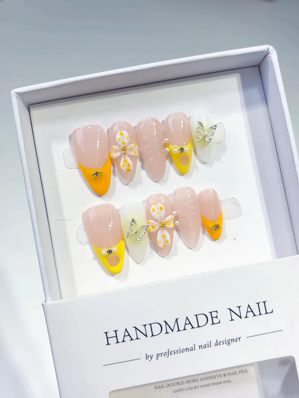 Nude Yellow White French tip Flower Metallic Charm Rhinestone press on nails angled view