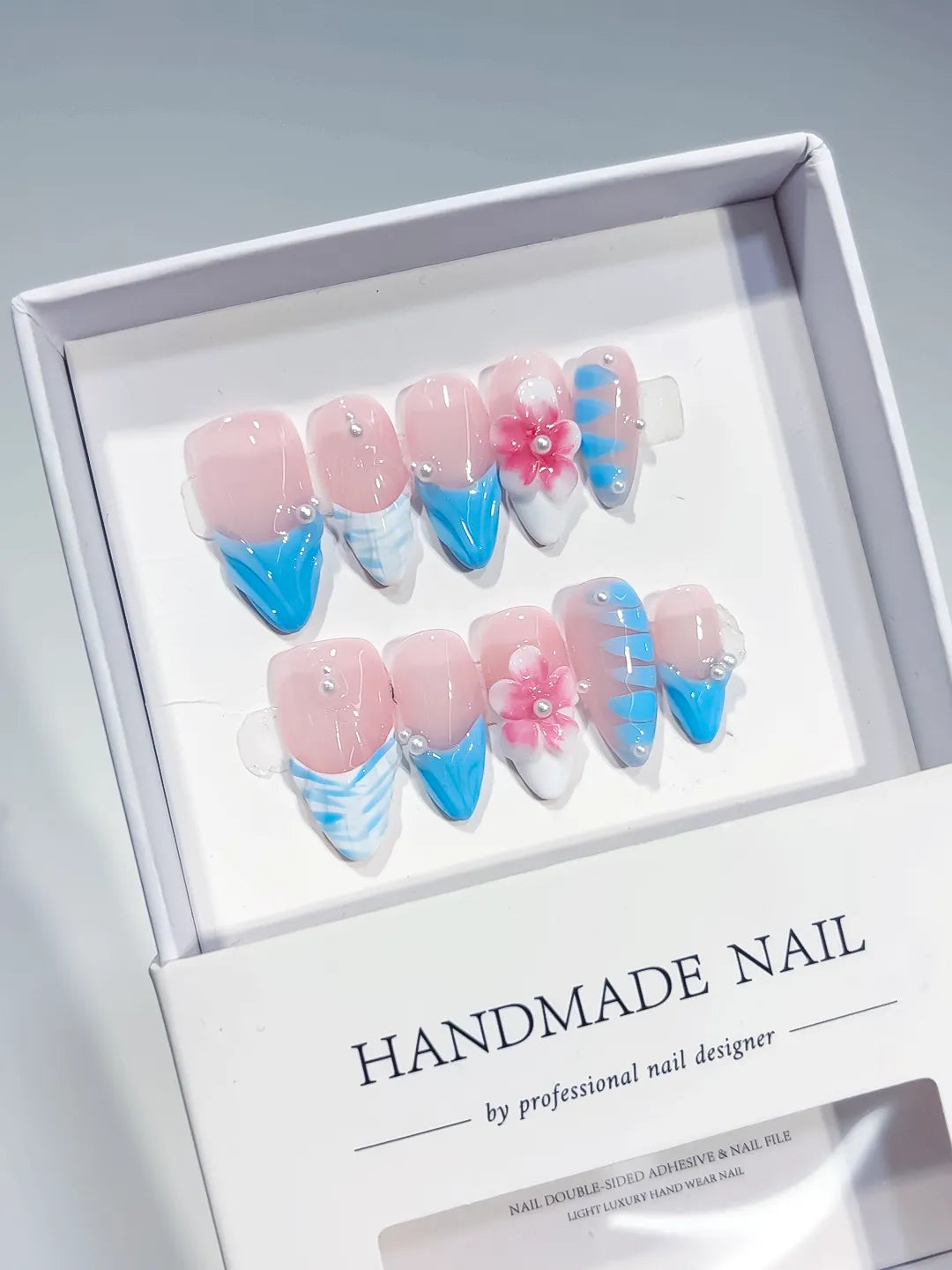 Pink Blue White French tip Flower Pearl Shell press on nails angled view