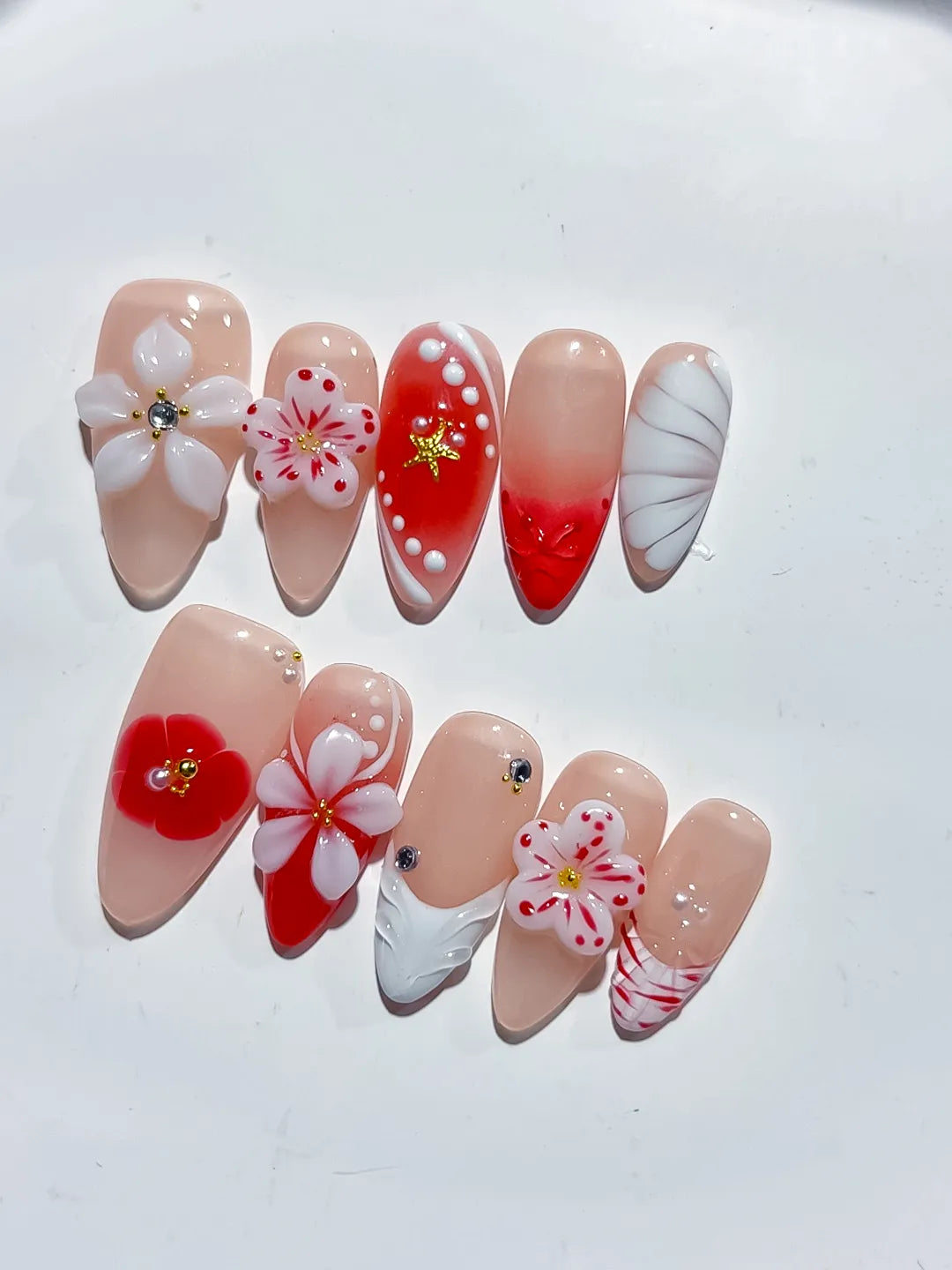 Nude Red White Abstract Flower Star Shell press on nails close up