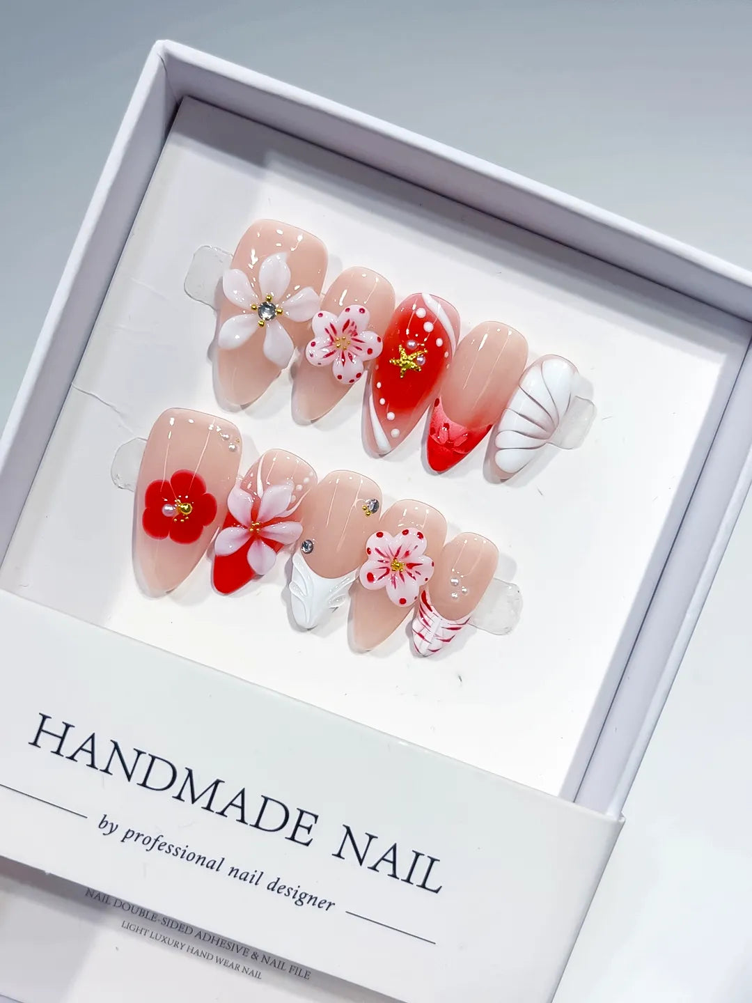Nude Red White Abstract Flower Star Shell press on nails detail view