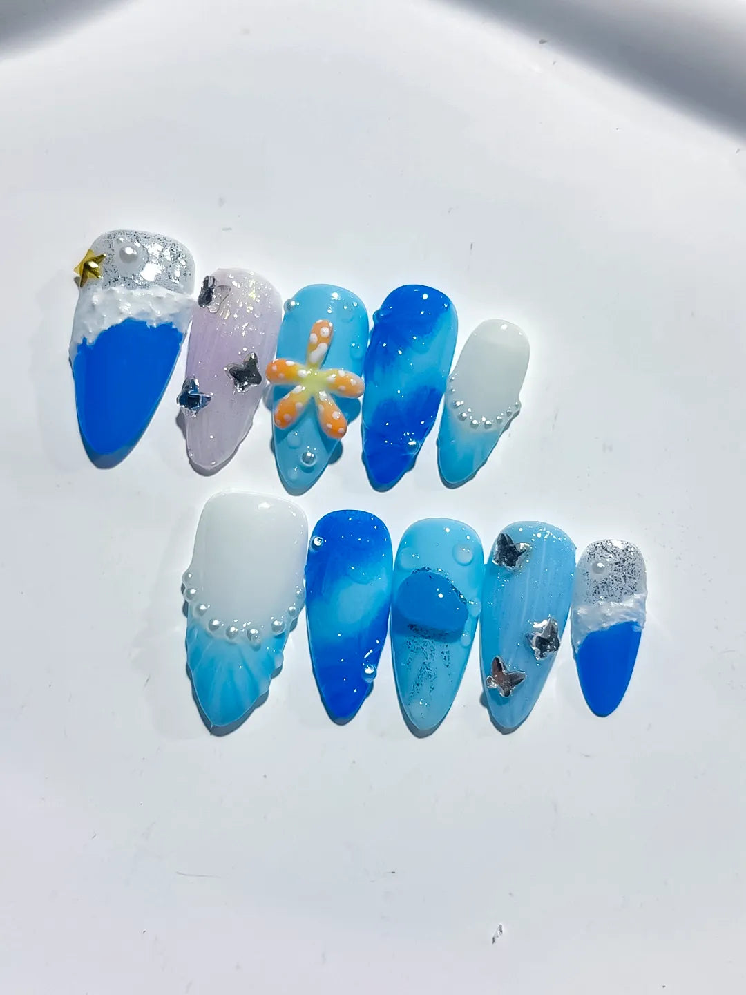 Blue White Silver Glitter Flower Star Shell press on nails close up