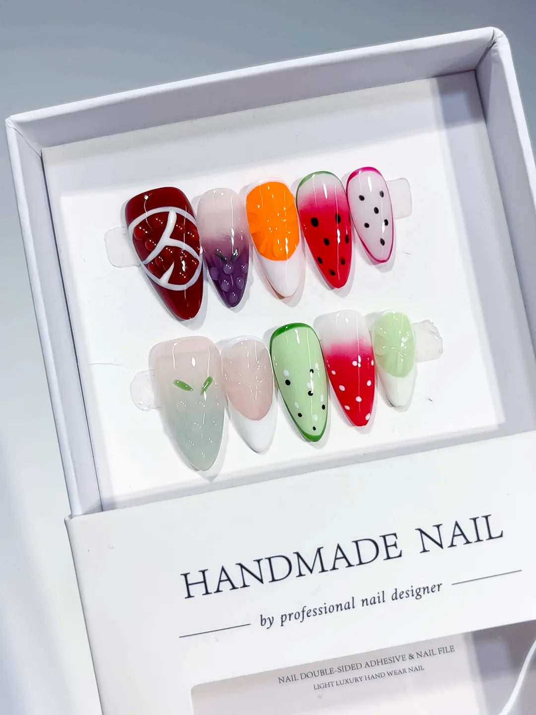 Red Pink Green White Abstract Fruit press on nails angled view