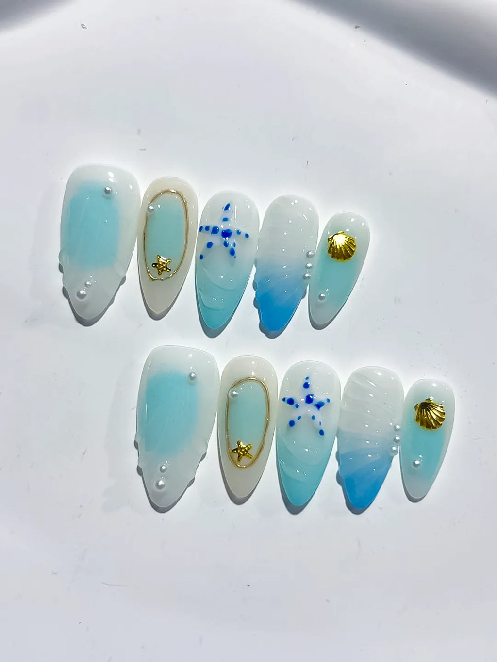 White Blue Gold Ombre Star Shell Metallic Charm press on nails close up