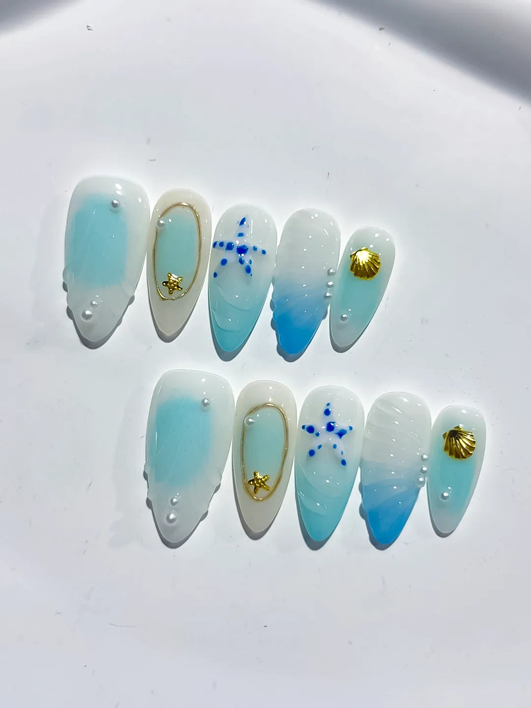 White Blue Gold Ombre Star Shell Metallic Charm press on nails close up