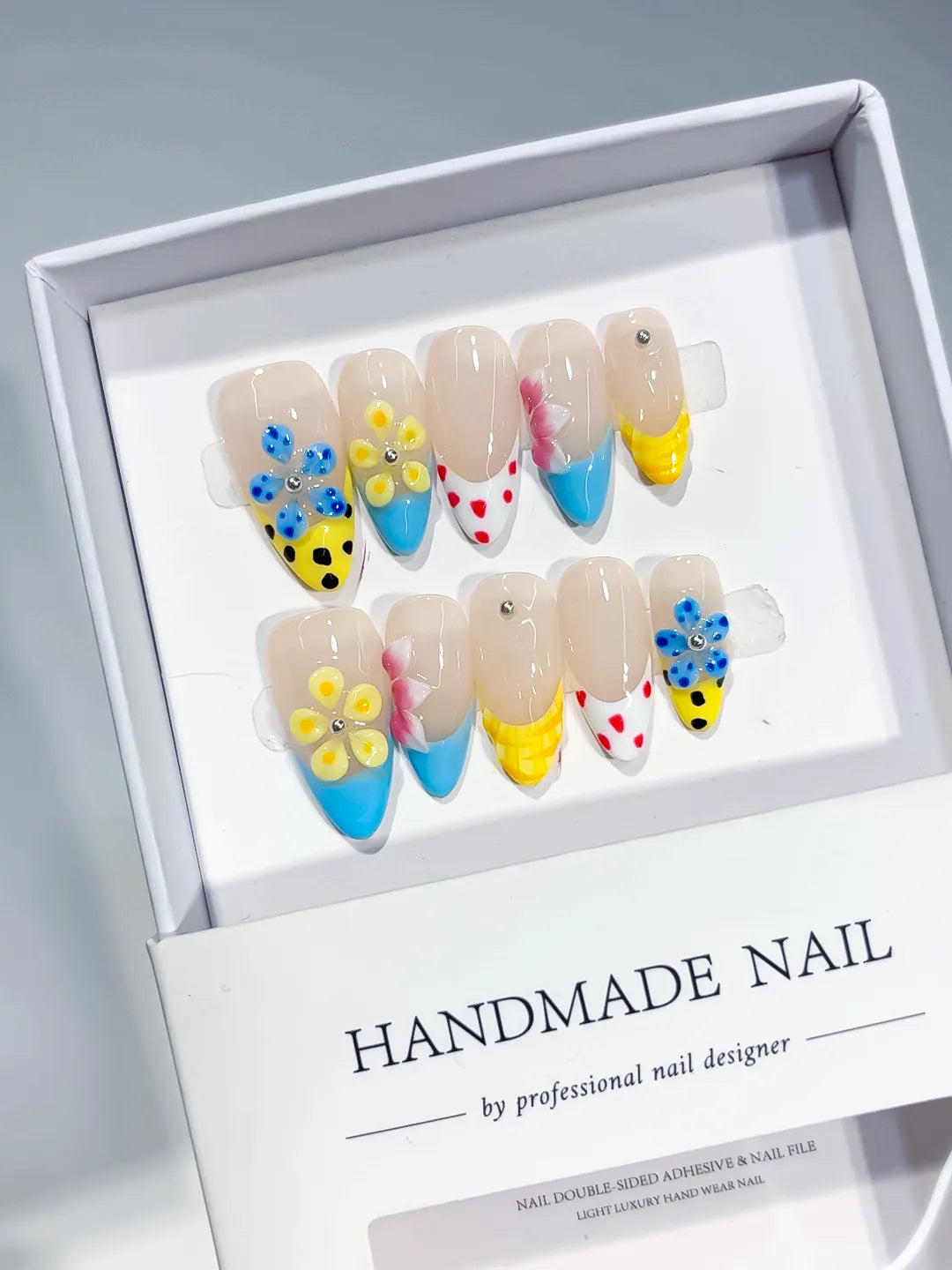 Nude Blue Yellow Pink Red Abstract Flower Dot Pattern press on nails angled view