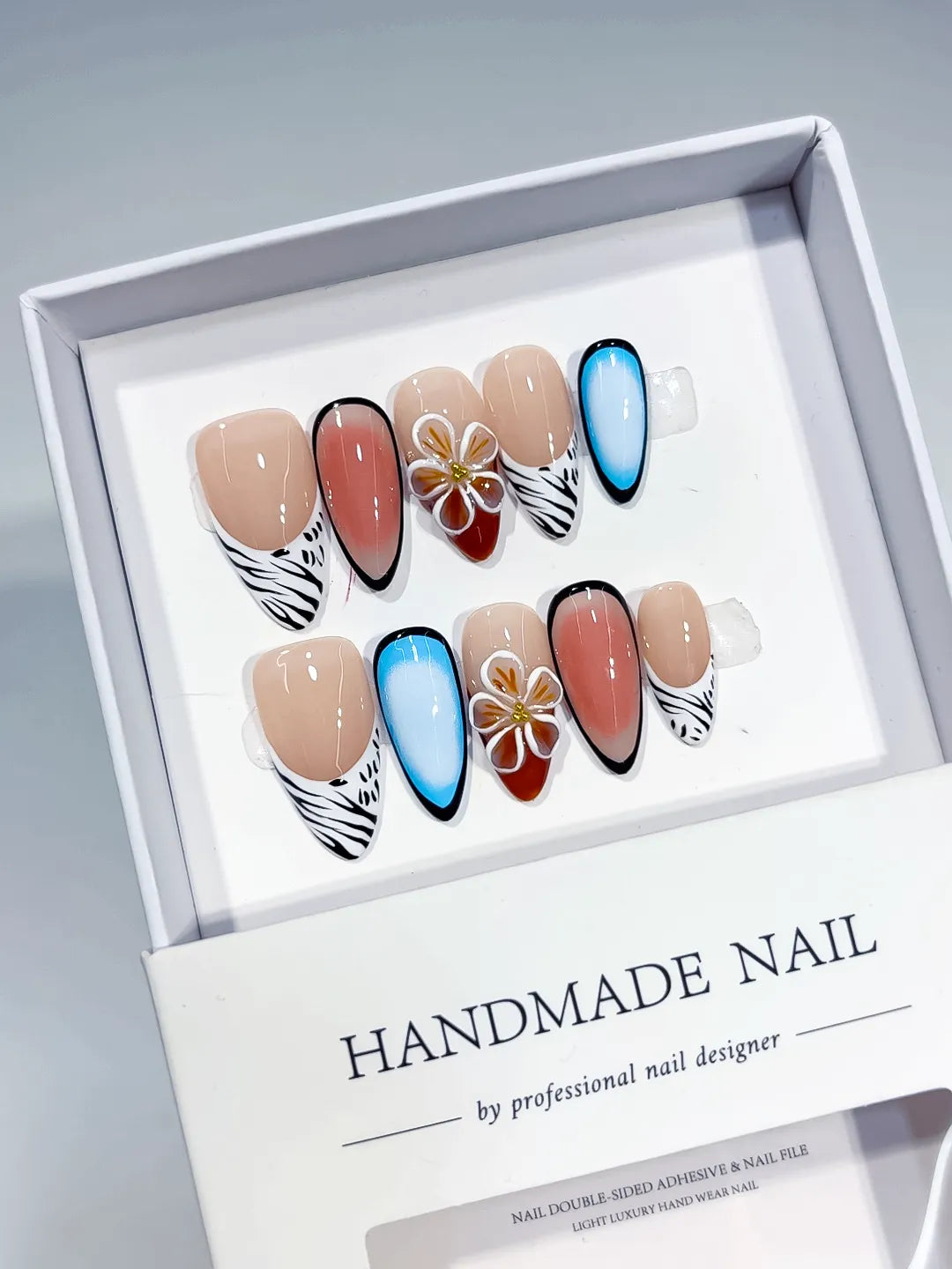 Nude Blue Black White Abstract Flower Animal Print press on nails angled view
