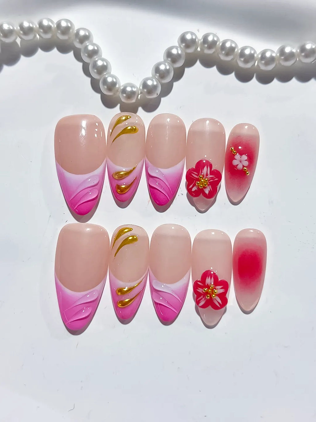 Gold Red Pink Nude press on nails close up