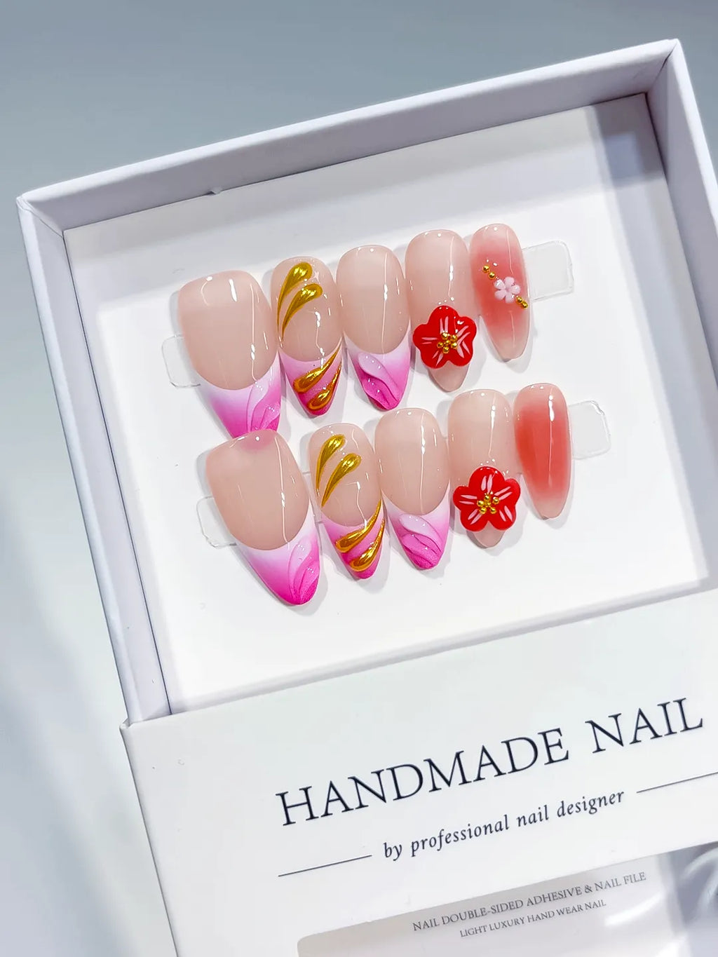 Gold Red Pink Nude press on nails angled view