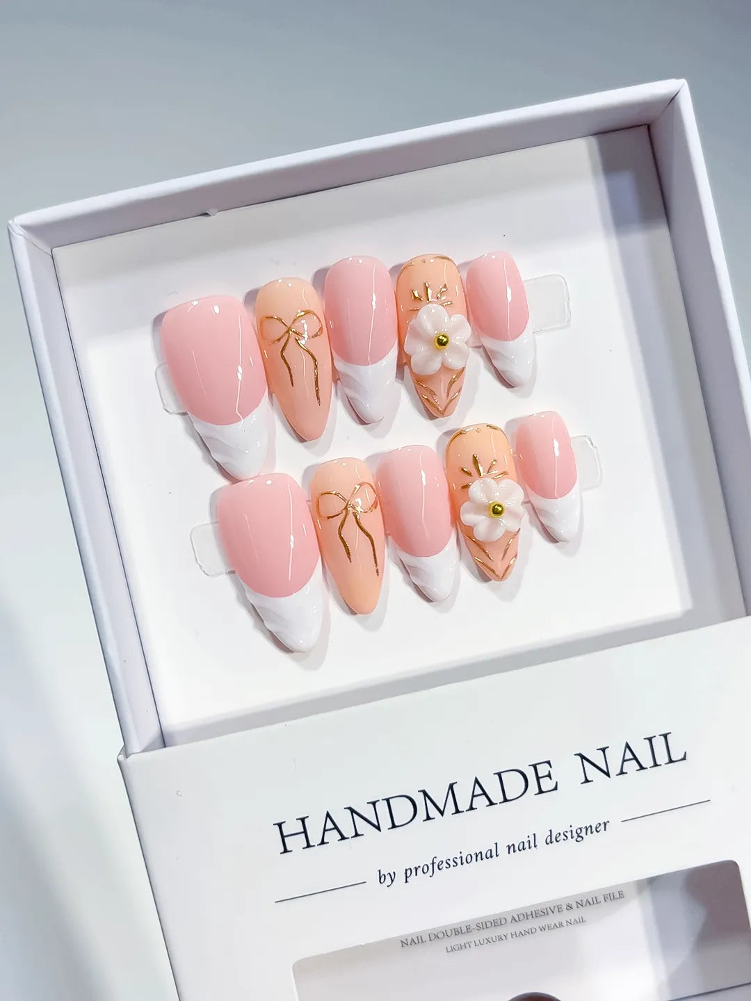 Pink White Nude French tip Flower Bow press on nails angled view