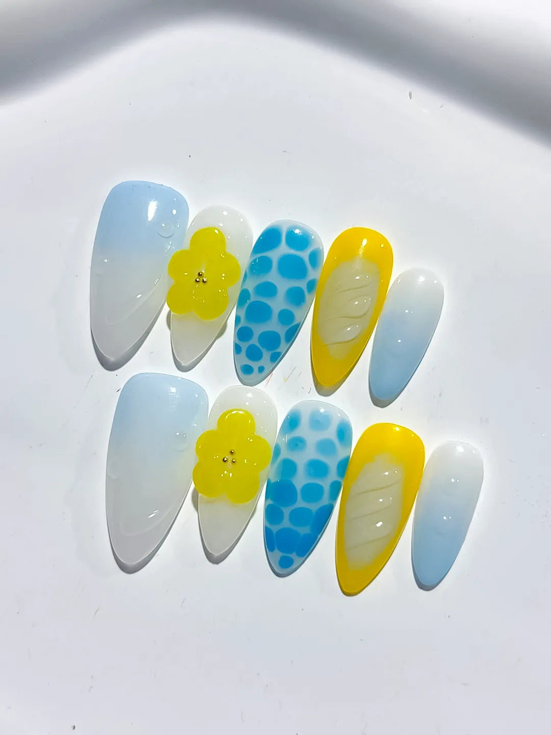 White Blue Yellow Abstract Flower Dot Pattern Shell press on nails close up