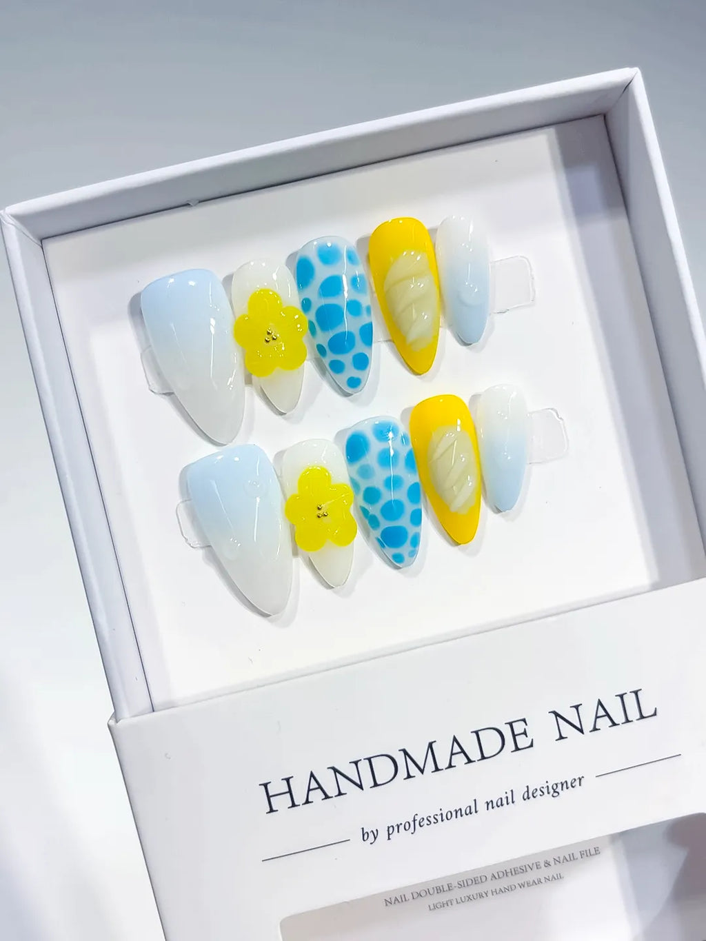 White Blue Yellow Abstract Flower Dot Pattern Shell press on nails angled view