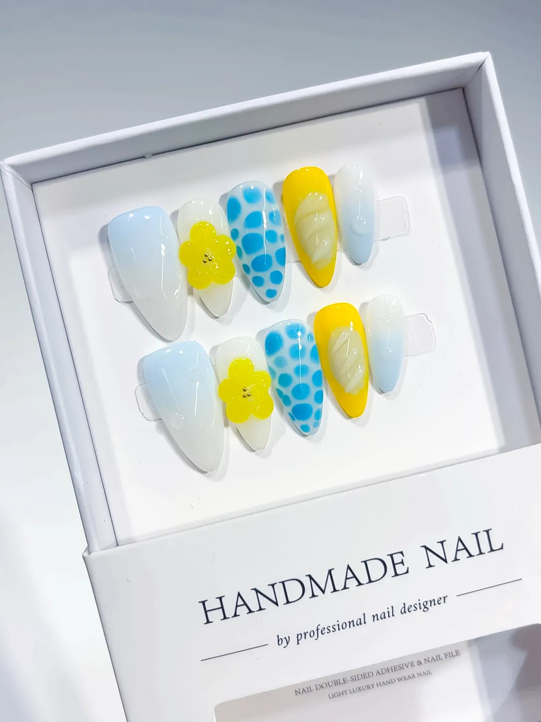 White Blue Yellow Abstract Flower Dot Pattern Shell press on nails angled view