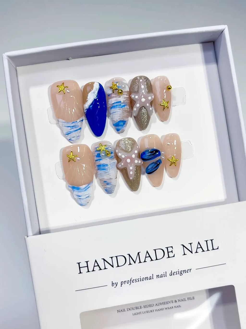 Nude Blue White Gold Abstract Starfish Shell Glitter press on nails angled view